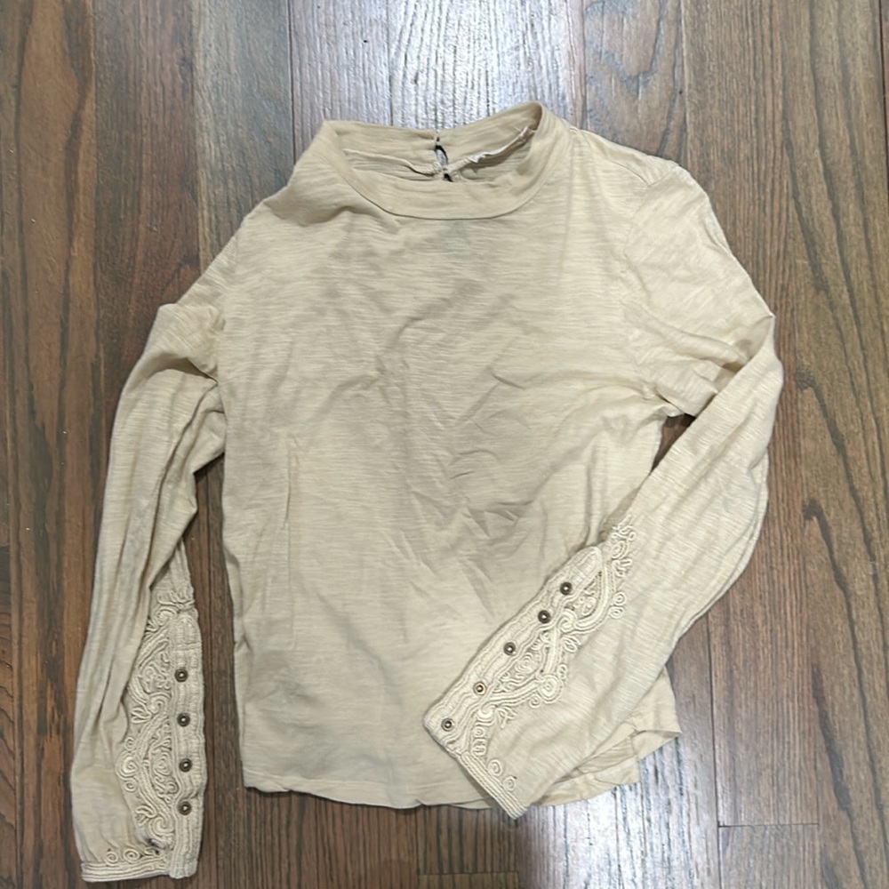 Free people size medium shirt with funky floral sleeves